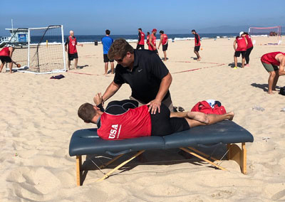 Chiropractor Torrance CA Brad Barez Adjusting Patient On Beach