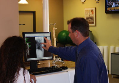 Chiropractor Torrance CA Brad Barez Discussing Results With Patient