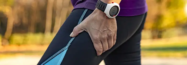 Chiropractic Torrance CA Leg Pain A person holding their upper thigh in pain.